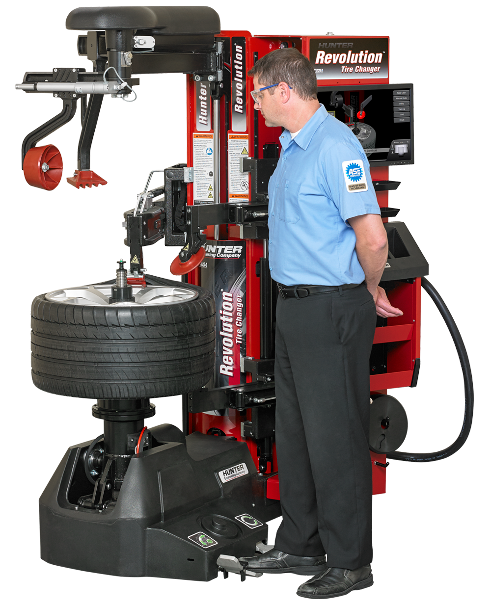 A man changing a tire in the tires and wheel services department