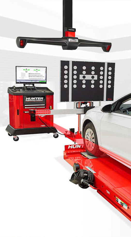 A mechanic performing state of the art wheel alignment services