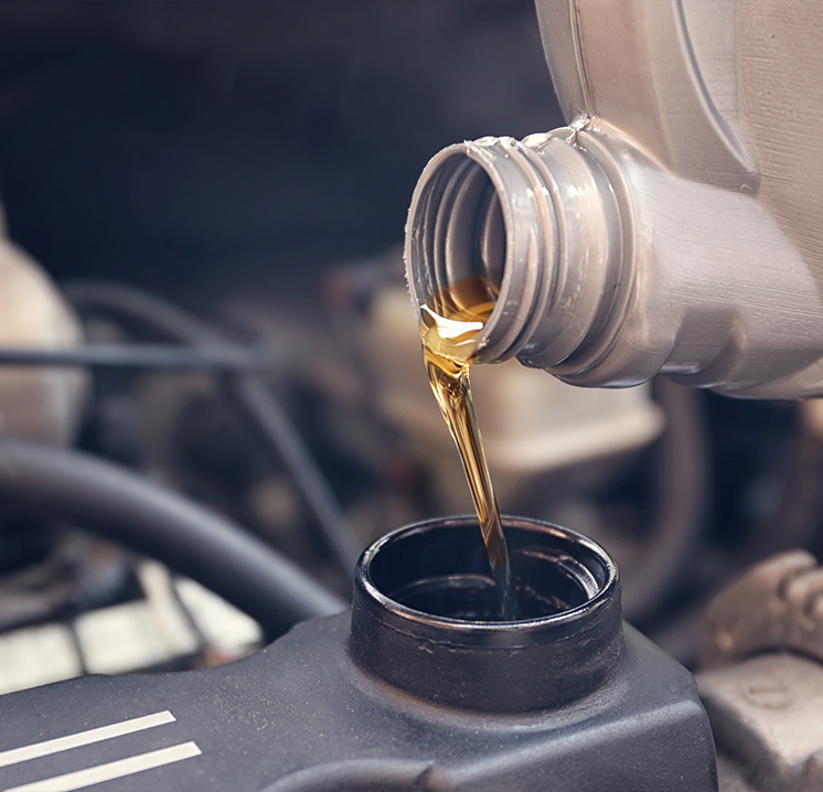 Oil being poured during an oil change for your import vehicle